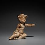 Oud-Grieks Terracotta Kindfiguur. 4e eeuw v.Chr. Hoogte 6