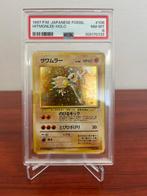 Pokémon - 1 Graded card - HITMONLEE HOLO 106 JAPANESE FOSSIL, Hobby en Vrije tijd, Verzamelkaartspellen | Pokémon, Nieuw