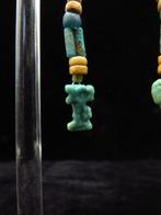 Égypte ancienne Boucles doreilles en faïence avec des