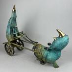 Dariusz Zielinski - Rhinoceros with a Reader in a Chariot