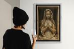 CARCANVAS_IT - Wooden Madonna praying in a cardboard box