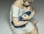 Royal Copenhagen - Figurine - Girl with Doll #1938 -