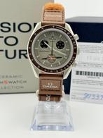 Omega x Swatch - MoonSwatch - Mission to Saturn - Sans prix, Handtassen en Accessoires, Horloges | Heren, Nieuw
