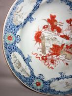 Assiette à décors de Paysage dans des médaillons (Vendu sans