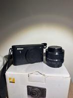 Nikon 1 J1 + Nikkor 1 10-30 Appareil photo numérique, Audio, Tv en Foto, Nieuw