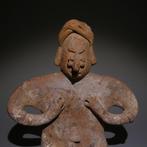Colima, Westkust Mexico Terracotta Zittend figuur. 12 cm H.