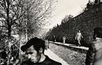 Gilles Peress - Men Walking on Wall. Tabriz, Iran 1980 -