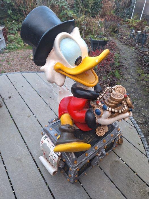 Disney - Vintage beeld - Dagobert Duck zittend op zijn, Verzamelen, Disney