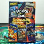 Madness Mystery Box - Charizard Graded Card + 2 Boosterpacks