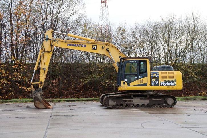 Veiling: Rupsgraafmachine Komatsu HB215LC-3 Hybrid 110kW 201, Zakelijke goederen, Machines en Bouw | Kranen en Graafmachines, Ophalen