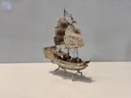 A Chinese silver filligree junk, the two masted ship, upon