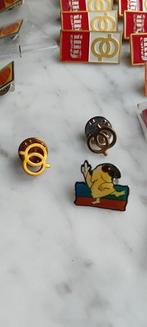 Collectie merkartikelen - 27 spellen/pins jaren 90 -