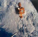 NASA - Space Shuttle Discovery & SPARTAN Satellite Over the