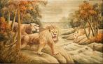 A embroidery silk of two lions and a lioness along the bank