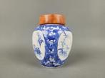 Lidded jar with crackled ice and different flower