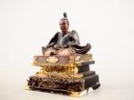 Statue of Sugawara no Michizane enshrined in a shrine -