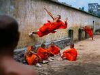 Steve McCurry - Shaolin Monk Running on Wall, 2004