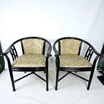 pair of black lacquered club chairs with gold-colored, Maison & Meubles