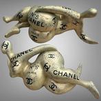 AmsterdamArts - Big Chanel champagne curvy woman statue
