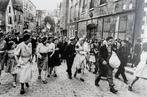 Robert Capa/Magnum - Women collaborator paraded in the