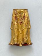 Een grote onderste deel van een Tibetaans verguld Boeddha