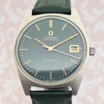 Omega - Genève - Cal. Omega 565 - Green Dial - 166041 -, Handtassen en Accessoires, Horloges | Heren, Nieuw