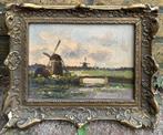 J.M Beek (1879-1965) - Hollands landschap met molens