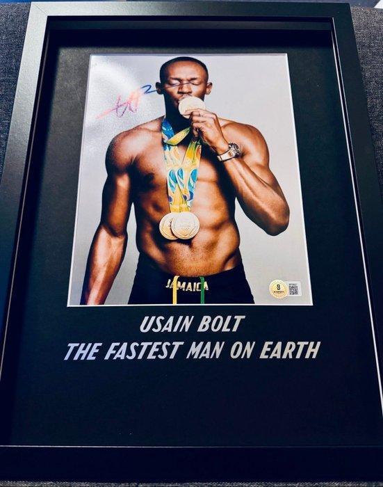 Usain Bolt - Gesigneerde afbeelding in 40x30 cm Custom Frame, Verzamelen, Overige Verzamelen