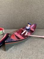 Onbekend - Poupée - Houten boot met roeier en roeispanen -