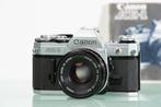 Canon AE-1 + FD 1,8/50mm S.C. Single lens reflex camera, Audio, Tv en Foto, Nieuw