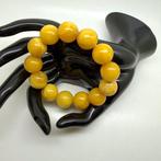 Armband met Baltische barnsteen kralen in eierdooierkleur,