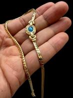 Intrigerende vintage halsketting met een goudkleurige platte