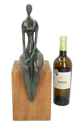 Beeldje - A seated woman - Brons