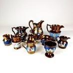 A nice collection of English copper luster jugs from the