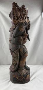 Offerdrager bij de Bali-tempel - Hout - Indonesië - Begin