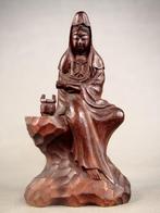 Kannon Bodhisattva wearing white robes and holding a