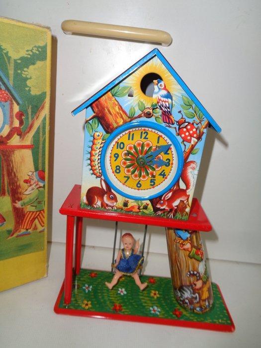 Joustra - Penduleklok met kind op schommel, verpakt. -, Antiek en Kunst, Antiek | Speelgoed