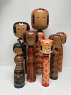 Een indrukwekkende set vintage Kokeshi in verschillende