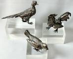 Collectie met dierenthema - Tinnen vogelbeeldjes