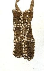 Set van twee Asmat-objecten: bullroarer en sjamaan-tas -