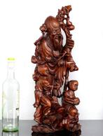 Een groot Chinees Shoulao en jongens-beeld. - Hardhout