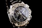 Omega - Speedmaster Split Seconds Chronograph Steel Carbon, Handtassen en Accessoires, Horloges | Heren, Nieuw