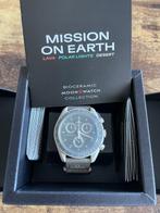 Swatch - MoonSwatch. Mission on Earth. Desert - Sans Prix de, Handtassen en Accessoires, Horloges | Heren, Nieuw