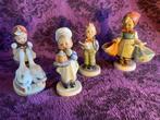 Beeldje - A collection of vintage Goebel Hummel figurines.