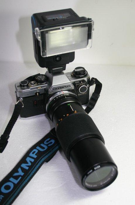 Olympus OM-10 +28mm/50mm/10-200mm + Acc + manual adapter, Audio, Tv en Foto, Fotocamera's Analoog