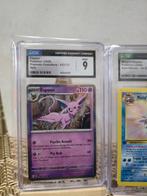 Pokémon - 3 Graded card - Espeon, Cloyster, Zekrom 033/131,, Hobby en Vrije tijd, Verzamelkaartspellen | Pokémon, Nieuw