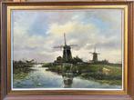N.G van Os (1895-1976) - Landschap met molens