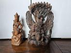 2 sculpturen : Dewi Ratih en Kala Rahu, Vishnu op Garuda -
