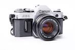 Canon AE1 + Canon FD 50mm f1.8 + Makinon 28mm f2.8 + boite, Audio, Tv en Foto, Nieuw