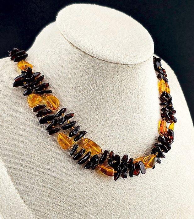 Adembenemende tweekleurige amberketting – Baltische kers en, Antiek en Kunst, Curiosa en Brocante